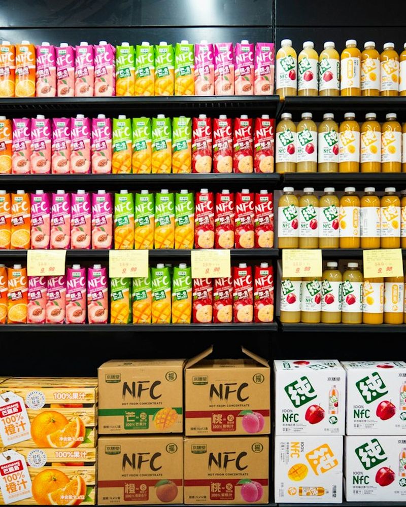 Shelves of juice bottles and cartons